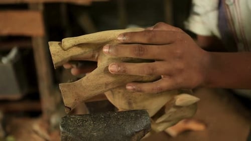 Craftsperson Carving Wooden Elephant Sculpture Close-Up