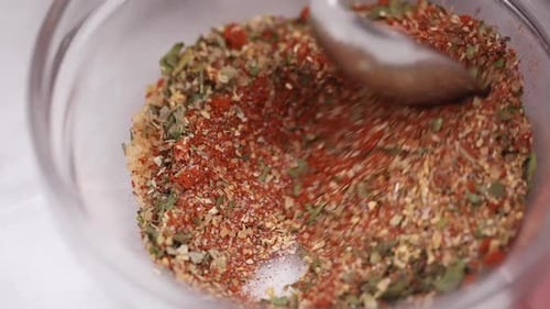 Close up of mixed spices in a glass jar for culinary use