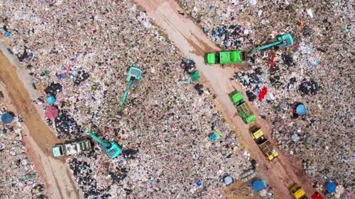 4K Timelapse : Aerial view from a drone flying over a large pile of garbage