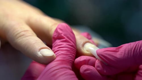 Close up of beautiful female hands manicure treatment in beauty salon 4K