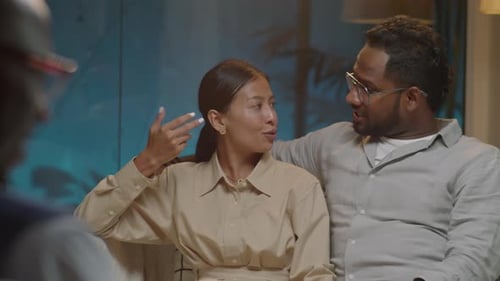 Couple Talking With Therapist During Counseling Session