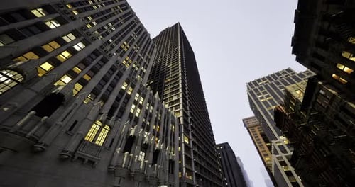 Skyscrapers Illuminated at Twilight in a Bustling Urban Area