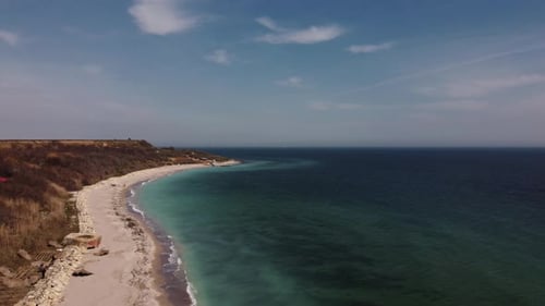 Aerial View Of Sandy Beach And Turquoise Water On a Beautiful Day