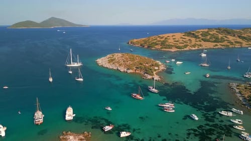 Aerial view of Paradise Cove with sailboats and turquoise water, Bodrum, Turkey.