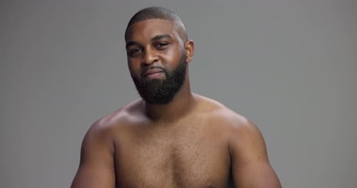 Studio, black man and face with confidence for skincare, hygiene and model with happiness