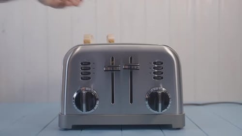 Placing Bread Slices into a Toaster