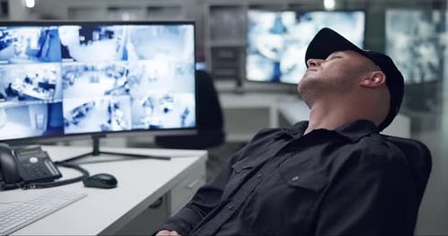 Sleeping, security guard and computer for surveillance, camera and cctv monitor for company safety