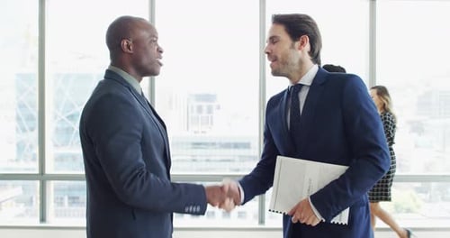 Business Handshake in Bright Modern Office Building