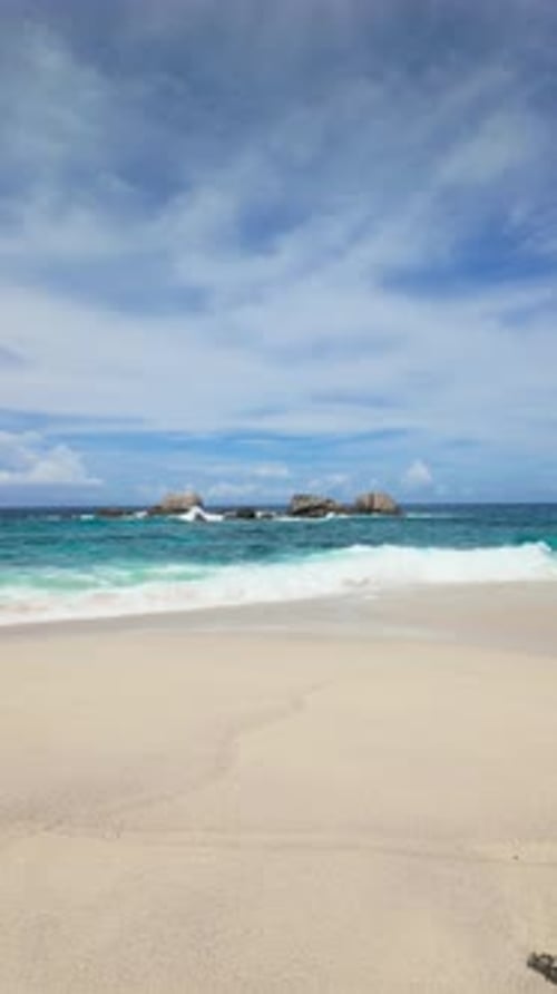 Vibrant Turquoise Sea with Rocks and White Sandy Beach Seychelles Mahe