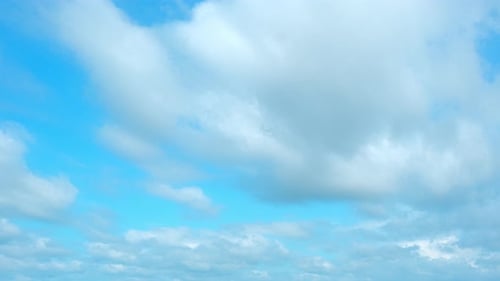 4K sky timelapse : amazing white clouds floating in the blue sky