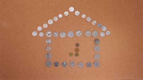 Stop Motion of a House Symbol Made Up of Coins Symbol of Home Building