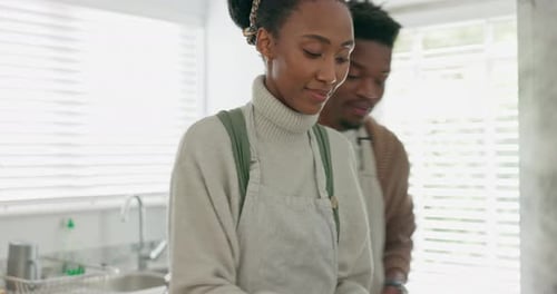 Smiling Couple Cooking Healthy Vegetables in Kitchen Together
