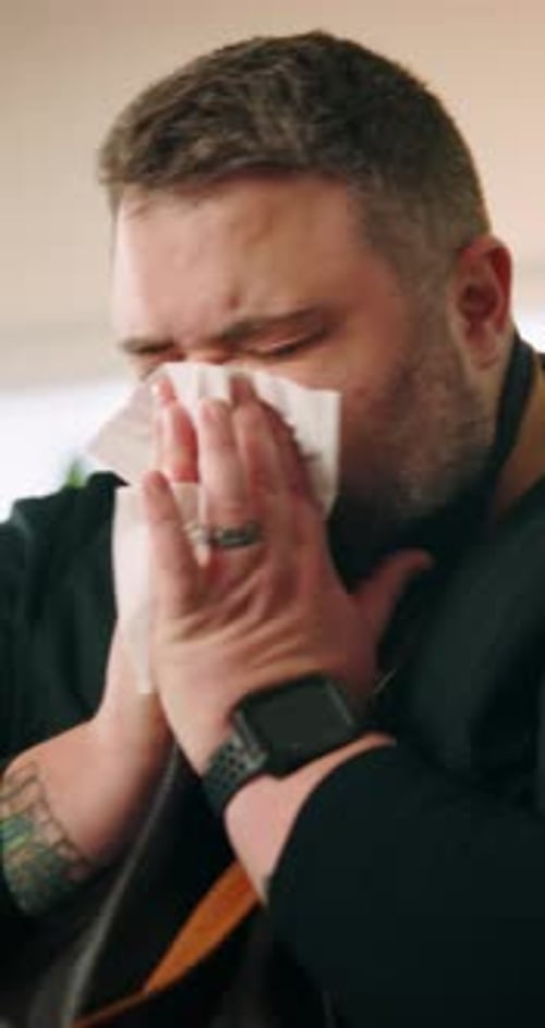 Man Uses Tissue for Cold or Allergies