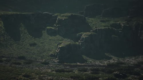 A Group of Rocks in the Middle of a Field Mountain Path