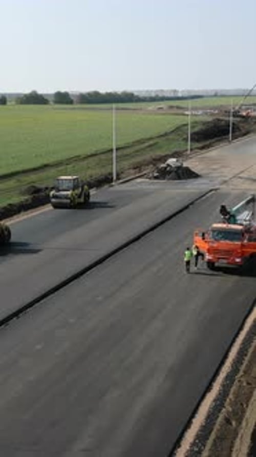 Road Construction Crew Paving New Asphalt Highway Clip