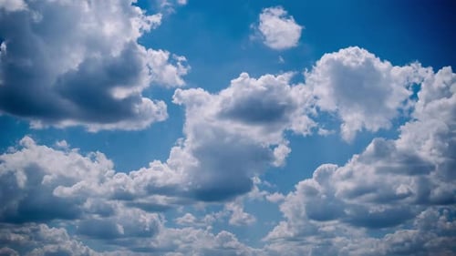 Clouds Drifting Across a Sunny Blue Sky