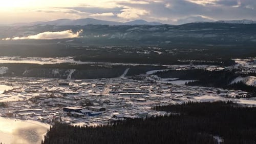 Aerial at Sunset Over Snowy Whitehorse with Frozen Yukon River