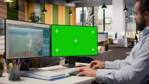 Ingenieur arbeitet am futuristischen Windturbinenkonzept auf einem Greenscreen-PC
