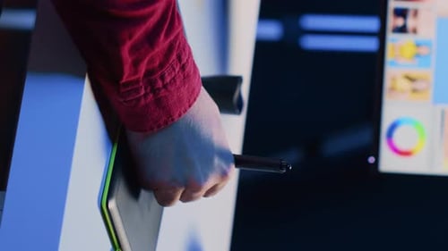 Hand Using Stylus on Digital Tablet