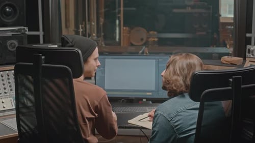 Musicians Creating Music at Record Studio