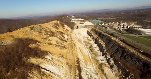 Aerial of sand mine used for accessing silica to make glass on a beautiful winter morning.