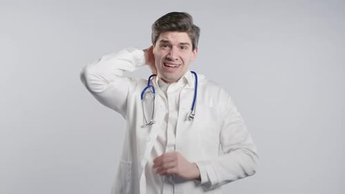 Frustrated Doctor Gesturing Anxiously in Studio