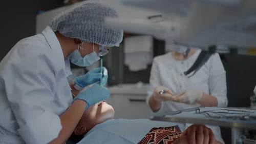 Whitening Teeth Treatment In Modern Dental Clinic Patient Lying In Chain Dentist Appointment