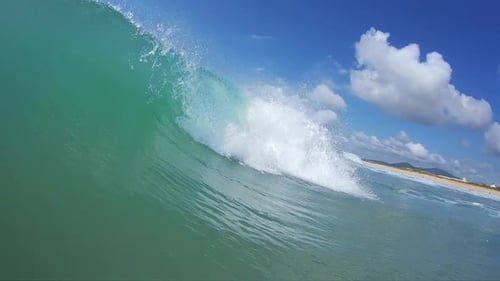 Ocean wave breaks on the shore
