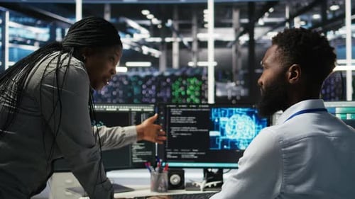 Data Center Supervisor Overseeing Work Done By Engineer Using Deep Learning