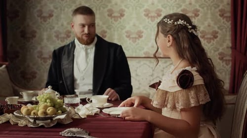 Elegant Couple at Table in a Historical Setting