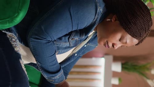 Woman Using Mobile Phone Indoors