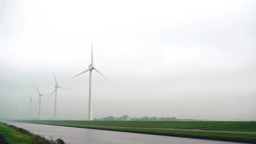 Wind Turbines Farm in Green Field