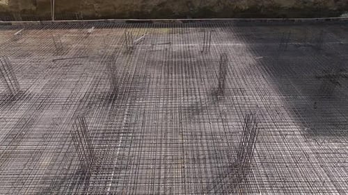 Aerial View Construction Workers Bending Rebar and Setting Up Building Foundation
