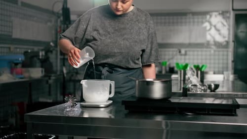 Woman Preparing Sweet Recipe in Professional Kitchen