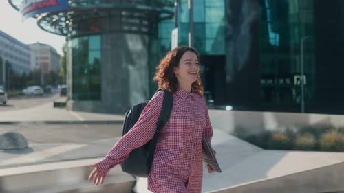 Cheerful Students Laugh and Greet Each Other Outside University