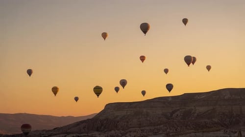 Time Lapse of Hot Air Balloons in Cappadocia, Turkey at Morning Flying Above Hills