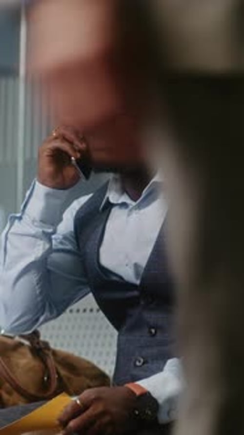 Airport Terminal Businessman Angry About Delayed Flight Holding Airplane Ticket Talking on