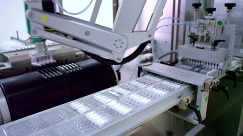 Automated Pharmaceutical Manufacturing of Sealed Vials on Conveyor