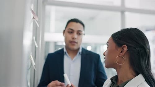 Glass wall, teamwork and business people brainstorming, strategy or schedule reminder in office