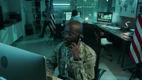 Military Personnel Working on Computers at Night
