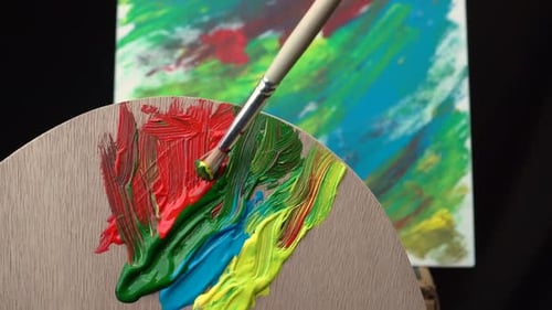 Mixing Colorful Paints on Palette for Abstract Painting