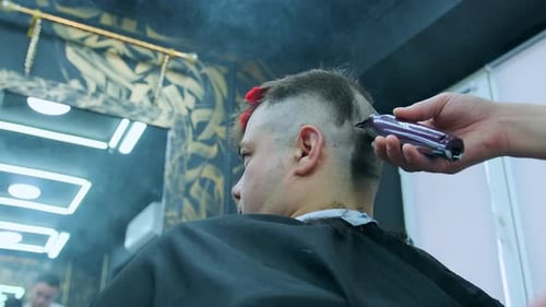 Adult Man Gets Haircut at Modern Barber Shop