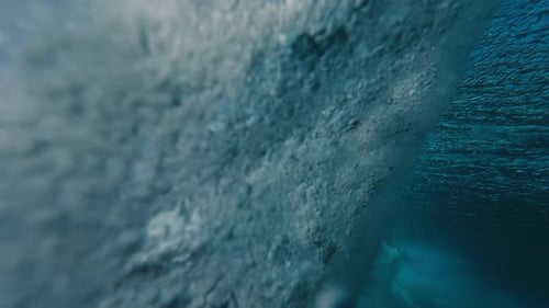 Underwater View of the Ocean Wave Rolling and Breaking Over the Shore in the Maldives