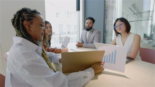 A Group of Diverse Professionals Working Together in a Contemporary Office Environment