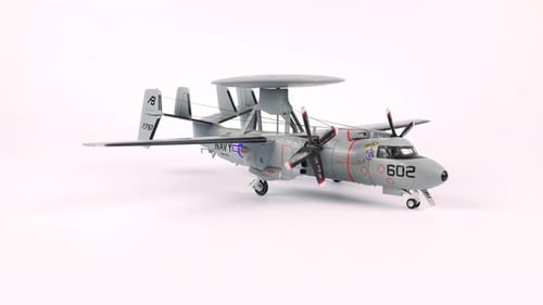 Scale Model Airplane Rotating on White Background