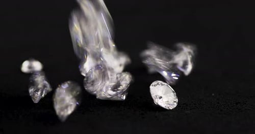 Diamonds Pouring onto a Black Surface