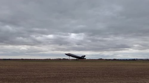 F-35A Lightning II Jet Landed And Taxiing On The Airport Runway With Landing Gear On. tracking shot