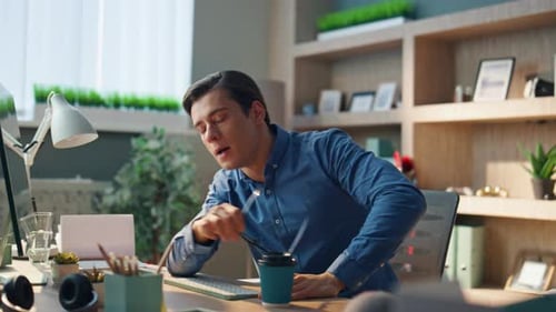 Young Adult Male Speaking in a Home Office