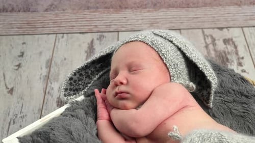 Precious Infant Sleeping Peacefully in Bunny Hat