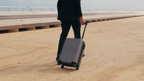 Tourist Man with Suitcase Baggage in Spain A Traveler with Luggage Suit Jacket on Business Street Go